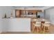 Bright kitchen with stainless steel appliances and bar top seating at 5315 S River Dr, Tempe, AZ 85283