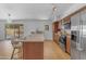 Bright kitchen featuring a peninsula island, stainless steel appliances, and a breakfast bar at 5315 S River Dr, Tempe, AZ 85283