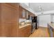 Gourmet kitchen with stainless steel appliances and modern wood cabinets at 5315 S River Dr, Tempe, AZ 85283