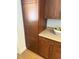 Kitchen features natural wood cabinets with silver hardware and light countertops at 5315 S River Dr, Tempe, AZ 85283