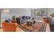 Bright living room boasts a comfortable sofa, large window, and hardwood floors at 5315 S River Dr, Tempe, AZ 85283