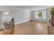 Bright living room features wood floors and a picture window with lots of natural light at 5315 S River Dr, Tempe, AZ 85283