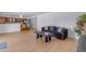 Open concept living room with light wood floors and adjacent kitchen at 5315 S River Dr, Tempe, AZ 85283