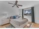 Serene bedroom featuring a ceiling fan, stylish rug, and window offering neighborhood views at 5315 S River Dr, Tempe, AZ 85283