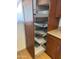 Kitchen pantry boasts pull-out shelves for easy organization and accessibility at 5315 S River Dr, Tempe, AZ 85283