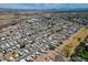 Expansive aerial view of a vibrant mobile home community with stunning mountain views and convenient highway access at 625 W Mckellips Rd # 80, Mesa, AZ 85201