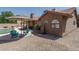 Enjoy this private backyard, featuring a pool, patio, and desert landscaping at 7632 W Crocus Dr, Peoria, AZ 85381