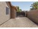 Gated side yard with desert landscaping, perfect for storage or a pet area at 7632 W Crocus Dr, Peoria, AZ 85381