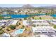 Serene community view showcasing a pool and adjacent lake with mountain backdrop at 8107 E Vista Dr, Scottsdale, AZ 85250
