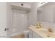 Bright bathroom with shower stall, toilet, vanity, sink, and marble countertop at 8107 E Vista Dr, Scottsdale, AZ 85250
