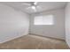 Cozy bedroom with carpet, ceiling fan and a window with blinds for privacy at 8107 E Vista Dr, Scottsdale, AZ 85250