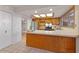 Bright kitchen features tile floors, wood cabinets, stainless steel appliances, and natural light at 8107 E Vista Dr, Scottsdale, AZ 85250