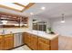 Bright kitchen featuring wooden cabinets, stainless steel appliances, white countertops, and natural lighting at 8107 E Vista Dr, Scottsdale, AZ 85250