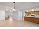 Spacious kitchen with tile floor, stainless steel appliances, and breakfast bar at 8107 E Vista Dr, Scottsdale, AZ 85250