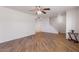 Spacious living room featuring wood-look tile floors and staircase at 8107 E Vista Dr, Scottsdale, AZ 85250