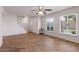 Spacious living room with wood-look flooring, abundant natural light, and neutral color scheme at 8107 E Vista Dr, Scottsdale, AZ 85250