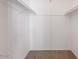 Spacious walk-in closet featuring ample storage with rods and shelves for organization at 8107 E Vista Dr, Scottsdale, AZ 85250