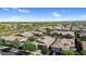 Enjoy a scenic aerial view of the neighborhood and surrounding landscape at 10741 E Palladium Dr, Mesa, AZ 85212