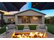 Tranquil backyard with fire pit, seating and sunset at 10741 E Palladium Dr, Mesa, AZ 85212