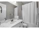 Clean bathroom featuring a shower-tub combo, bright white vanity, and modern fixtures at 10741 E Palladium Dr, Mesa, AZ 85212