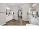 Bright bathroom with tile floors offers a double sink vanity and is connected to the bedroom at 10741 E Palladium Dr, Mesa, AZ 85212