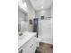 Clean bathroom featuring a shower-tub combo, bright white vanity, and a mirror at 10741 E Palladium Dr, Mesa, AZ 85212