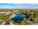 A community pond bordered by winding sidewalks and lush landscaping at 10741 E Palladium Dr, Mesa, AZ 85212