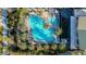 Get an aerial view of the sparkling pool, surrounded by palm trees and lounge chairs for the perfect poolside escape at 10741 E Palladium Dr, Mesa, AZ 85212