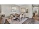 Elegant dining room featuring a wooden table, six chairs, neutral décor, and wood-look flooring at 10741 E Palladium Dr, Mesa, AZ 85212