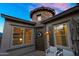 Inviting front entrance featuring a decorative stone turret and a charming front door with a floral wreath at 10741 E Palladium Dr, Mesa, AZ 85212