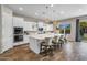 Bright kitchen with stainless appliances, island seating, and an adjacent dining area, perfect for Gathering gatherings at 10741 E Palladium Dr, Mesa, AZ 85212