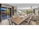 Open floor plan connects the dining area, kitchen, and living room, creating an inviting and spacious atmosphere at 10741 E Palladium Dr, Mesa, AZ 85212