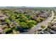 A quiet neighborhood street with mature landscaping at 10741 E Palladium Dr, Mesa, AZ 85212
