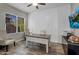 Home office with natural light, desk, chair, and modern decor, ideal for productivity and comfort at 10741 E Palladium Dr, Mesa, AZ 85212