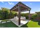 Relax under the shade of the beautiful backyard pergola at 10741 E Palladium Dr, Mesa, AZ 85212