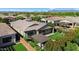 Stunning aerial view of home featuring a covered patio, manicured lawn, and lush landscaping at 10741 E Palladium Dr, Mesa, AZ 85212