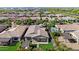 Aerial view of backyard showcasing covered patio, artificial grass, and professional landscaping at 10741 E Palladium Dr, Mesa, AZ 85212