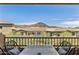 Exterior view of a patio with a seating area and a view of nearby buildings and mountains at 13450 E Via Linda -- # 2041, Scottsdale, AZ 85259