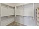 Well-organized walk-in closet featuring ample shelving and storage for clothes and accessories at 13450 E Via Linda -- # 2041, Scottsdale, AZ 85259