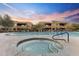 Community pool and hot tub offer a relaxing escape with beautiful desert landscaping and amenities at 13450 E Via Linda -- # 2041, Scottsdale, AZ 85259