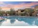 Large community pool offers a refreshing escape with surrounding lounge chairs and desert landscaping at 13450 E Via Linda -- # 2041, Scottsdale, AZ 85259