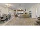 Spacious living room with fireplace, dining area, and views of the surrounding desert at 13450 E Via Linda -- # 2041, Scottsdale, AZ 85259