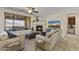 Inviting living room showcases a cozy fireplace, plush seating, and a large window with scenic views at 13450 E Via Linda -- # 2041, Scottsdale, AZ 85259