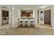 Open-concept living space with kitchen view, bar seating, and convenient laundry area at 13450 E Via Linda -- # 2041, Scottsdale, AZ 85259