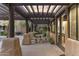 A covered patio with sandstone-styled table and benches offers a peaceful outdoor retreat and entry to the building at 13450 E Via Linda -- # 2041, Scottsdale, AZ 85259