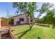 Well-maintained backyard with green lawn and partial home view at 15814 W Adams St, Goodyear, AZ 85338