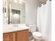 Bathroom featuring a white vanity sink, mirror, and toilet under neutral lighting at 15814 W Adams St, Goodyear, AZ 85338