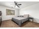Clean bedroom with neutral tones, ceiling fan and cozy carpet; perfect for relaxation and rest at 15814 W Adams St, Goodyear, AZ 85338