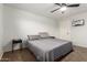 Minimal bedroom with neutral tones, ceiling fan and cozy carpet; perfect for relaxation and rest at 15814 W Adams St, Goodyear, AZ 85338