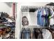 Organized walk-in closet providing ample storage space for clothing, shoes, and accessories at 15814 W Adams St, Goodyear, AZ 85338